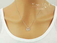 Personalized silver peace sign necklace. Choose letter/initial from the drop-down list above. This elegant peace sign has a smooth semi matte/satin finish, and hangs on a fine dainty chain.DETAILS :* Tiny peace charm measures 1/3" (9mm)* Chain length is 18 inches (45cm) * I am always happy to make your chain longer or shorter, free of charge. Simply write a note at the checkout. Your Zoe River jewelry will arrive gift-wrapped and in a sweet little organza giftbag, carefully packaged to arrive sa Adjustable Sterling Silver Peace Sign Jewelry, Silver Peace Sign Jewelry Gift, River Jewelry, Cat Necklace Gold, Peace Necklace, Peace Sign Necklace, Mother Daughter Necklace, Sign Necklace, Silver Mermaid