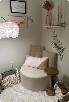 a round bed sitting in the corner of a room next to a wall with pictures on it