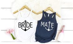 two shirts that say bride and mate with an anchor on the front, one is navy blue