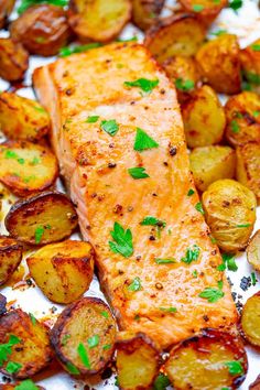 salmon and potatoes on a plate with parsley