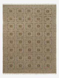 a beige and brown rug with square shapes on the bottom, surrounded by smaller squares