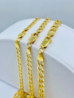 "Genuine 14K Yellow Gold Cuban/Curb Necklace. This classic necklace is an amazing gift for anyone. BEST PRICES AND SUPERIOR ITALIAN QUALITY! Metal: 14K Yellow Gold Necklace Length: 16inch 18inch 20inch 22inch 24inch CUSTOM AVAILABLE BY MESSAGING ME! Bracelet Length: 7in 7.5in 8in Necklace Width: 3.5mm 4mm 5mm Clasp: Lobster Country of Origin: Italy This is Italian 14K Gold. This is a semi hollow link bracelet/necklace crafted from Genuine Solid Yellow 14K Gold. Extra care must be taken against b Elegant Cuban Link Necklace Diamond Cut For Gift, Elegant Hallmarked Cuban Link Chain Necklace, 14k Yellow Gold Cuban Link Necklace With Oval Links, Gold Cuban Link Necklace With Diamond Cut, Gold Cuban Link Necklace Diamond Cut Gift, Gold Cuban Link Necklace With Diamond Cut As Gift, Gold Diamond Cut Cuban Link Necklace Gift, Elegant Yellow Gold Cuban Link Necklace For Anniversary, Gold Diamond Cut Chain Link Necklace