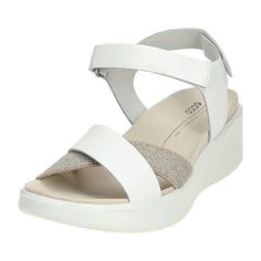 Step into style and comfort with the Ecco Flowt Wedge White Sandals, perfect for the fashion-forward young adult. Designed with both durability and elegance in mind, these sandals feature a sleek white finish that complements any outfit. The built-in wedge offers a subtle lift while ensuring maximum comfort, making them ideal for everyday wear or special occasions. Embrace a blend of luxury and practicality with these must-have sandals! White Wedges, White Sandals, Sandals For Women, Stylish Women, Womens Sandals, Fashion Forward, Everyday Wear, Built In, Wedges