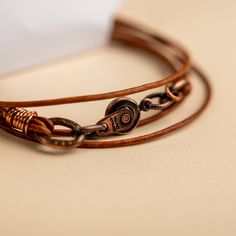 Approx. 14" Handmade in Laurel, Mississippi Beautifully colored natural brown leather with Novi's signature clasp allowing it to snap together with other NoVi bracelets for an original look. Wraps around the wrist twice, or can be worn as a choker. For a looser fit, add an extender! Everyday Brown Jewelry With Waxed Finish, Brown Leather Wrap Bracelet As Gift, Brown Leather Wrap Bracelet Gift, Brown Leather Wrap Bracelet For Gift, Everyday Brown Leather Strap Jewelry, Brown Jewelry With Waxed Finish As Gift, Brown Waxed Finish Jewelry As Gift, Brown Leather Strap Wrap Bracelet Gift, Unique Brown Jewelry For Everyday