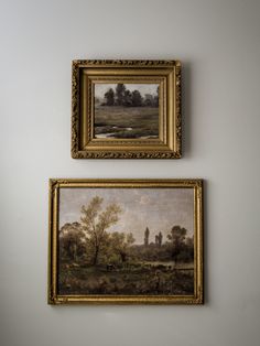 two paintings hanging on the wall next to each other