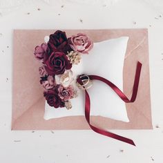 a pillow with some flowers on top of it