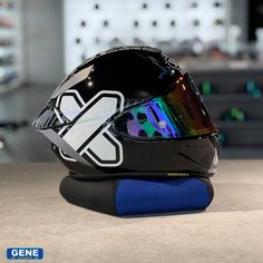 the helmet is on display in front of some other items that are sitting on a table