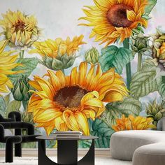 a living room with sunflowers painted on the wall and chairs in front of it