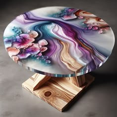 Admire this sophisticated resin art table, an abstract blend of purples, blues and pinks encapsulated in glossy resin. With a rustic wooden frame, it embodies elegance and creativity. #ResinArt #ModernFurniture #ArtisticTable #ElegantDecor #AbstractArt #HomeDesign