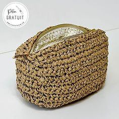 a woven basket sitting on top of a white table