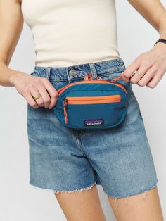 If you don't have one, probably you need one. This is a lightweight, tear- and weather-resistant mini hip pack with zipper pockets from Patagonia. Patagonia Belt Bag, Patagonia Crossbody Fanny Pack, Blue Pouch Belt Bag With Zipper Pocket, Patagonia Mini Hip Pack, Fanny Pack Cute, Fanny Pack Outfit, Fanny Pack Billabong, Hip Pack, Sustainable Bag