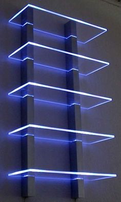 a tall building with blue lights on it's sides