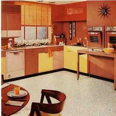 an old fashioned kitchen with orange walls and yellow cabinets is pictured in this photo from the 1950's