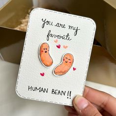 someone holding up a card that says you are my favorite human bean