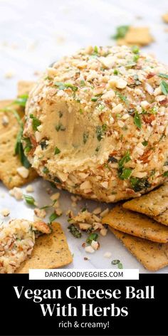 vegan cheese ball with herbs on top and crackers in the foreground text reads, vegan cheese ball with herbs rich & creamy