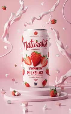 a can of milk with strawberries on it and splashes of milk in the air