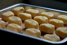 a pan filled with cookies sitting on top of a table