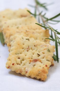 crackers with rosemary sprigs on white cloth