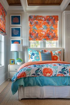 a bed in a bedroom with orange and blue decor