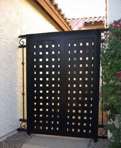 an iron gate in front of a house