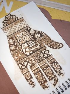 a drawing of a hand with intricate designs on it