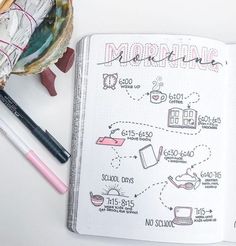 an open notebook with doodles and writing on it