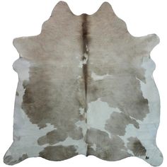 a brown and white cowhide rug on a white background