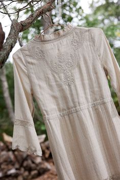 The Ahalya dress is a long, flowy , tiered dress with a prairie feel. It lives up to its name which means ' one with impeccable beauty'. It is perfect for transitional weather with its long sleeve and mock neck details. It features delicate Lucknowi hand embroidered motifs, scalloped edges and adjustable drawstring at waist with handmade tassels. Wear it in warmer weather with sandals or pair with your favorite boots and a vest for cooler months. The self patterned fabric gives it a simple, elev Lawn Dress Design, Dress Designing, Neck Details, Embroidered Motifs, Lawn Dress, Favorite Boots, Pink Maxi Dress, Scalloped Edges, Feel It