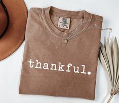 Thankful Shirt, Thanksgiving Shirt, Pumpkin Shirt, Womens Thanksgiving Shirt, Thanksgiving Family Shirt, Thankful Grateful Shirt, Fall Shirt 🌺How to Order, -Swipe to all of the pictures -Select Size and Color of the Product from drop down menus -Select Quantity -Add your chart and place order -For every single shirt you have to repeat every step 🌺Material Info -Ultra Soft -Sideseamed -Retail fit -Unisex Sizing -Shoulder taping 🌺Processing Time info -Standart process time 1-3 days, for the rush options please directly send me message via ETSY 🌺Shipping Info USA Orders -First Class 4-6 days -Priority mail 3-4 days (sometimes 4-5 days, especially during holiday season, Halloween-Christmas) -Priority EXPRESS mail 1-2 days Canada, Standard 7-21 Days Priority International Mail 6-10 days Int Thanksgiving T-shirts, Diy Thanksgiving Shirts, Thanksgiving T Shirt Ideas, Thanksgiving Shirt Ideas, Thanksgiving Tshirt Ideas, Fall Shirt Ideas, Fall Shirts Vinyl, Thanksgiving Tee Shirts, Thanksgiving Designs