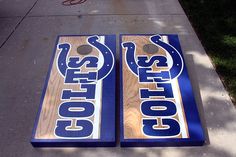 two cornhole boards sitting on the sidewalk