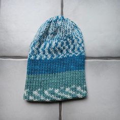 This super soft and plush hat is made from acrylic gauge 4 worsted yarn. The material is 80% acrylic and 20% wool and feels very soft. This hat will fit a medium to large adult, pending your head size. Unstretched it is 10 inches tall and 7.5 inches wide. It is very stretchy so it can stretch to be about 12 inches wide so it will fit a variety of heads.  It is a regular knitted pattern, double walled for an extra layer of warmth. It can be worn as a more slouchy beanie style or pulled down over the ears.  Machine washable and dryer friendly on cold wash and low heat. If you would like a custom hat or pattern let me know! Acrylic Yarn Beanie One Size Fits Most, Acrylic Yarn Beanie Cap One Size, Blue Knit Beanie Cap, Blue Knit Beanie Hat, Knitted Acrylic Beanie Cap, Blue Crochet Hat For Cold Weather, Acrylic Knitted Beanie Cap, Warm Blue Beanie Cap, Warm Blue Beanie Hat