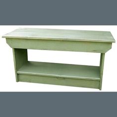 a green wooden table with two shelves on each side