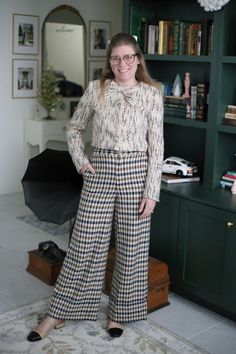 Pair a classic tweed jacket with plaid wide leg pants for a timeless and preppy fall and winter look.