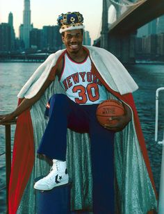 a man sitting on top of a boat holding a basketball