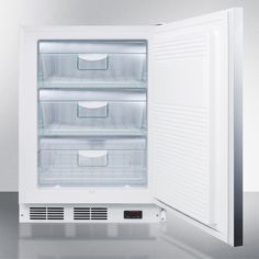 an empty refrigerator with its door open on a gray flooring surface and white walls