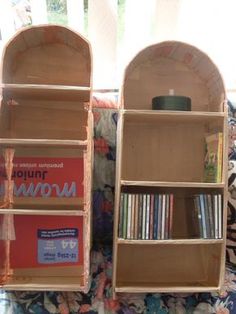 two wooden bookshelves sitting next to each other