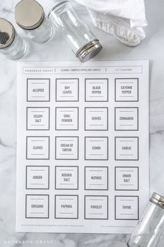 the printable labels for mason jars are displayed on a marble table with other items