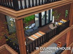 a balcony with furniture and plants on it, in front of a brick building that reads 19 culpeper house balcony