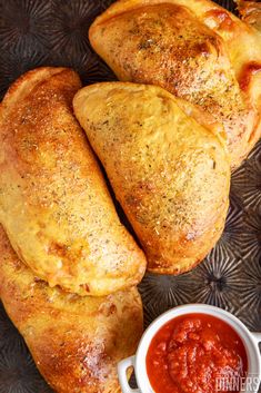 two pieces of bread on a plate with sauce