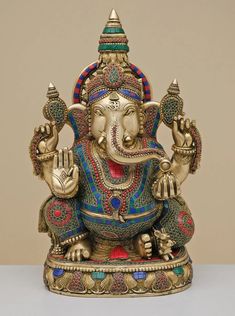 a statue of an elephant with two hands in the shape of a ganeshi