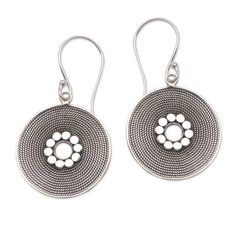 Mesmerizing in their beauty intricate rope patterns are handcrafted from sterling silver framing circle patterns at the center of these dangle earrings from Bali. Rupadana creates these earrings accentuated by a combination of finishes. Sterling Silver Circle Earrings With Oxidized Finish, Traditional Nickel-free Spiral Jewelry, Bohemian Sterling Silver Round Earrings, Artisan Earrings With Oxidized Finish, Bohemian Sterling Silver Circle Earrings, Artisan Nickel-free Circle Earrings, Artisan Round Filigree Earrings, Circle Patterns, Disc Earrings