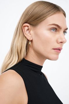 Modernism and minimalism collide in our Venus Drop Earrings. With a sleek profile and a reflective finish reminiscent of brilliant city lights, these sterling silver drop earrings are handcrafted to make your style shine day after day, night after night, season after season. Each pair includes a Marcella-branded vegan leather travel case for safe storage and easy travel.[SPLIT] Available in one size. Approximately .75” (2 cm) long. 18KT yellow gold plated brass. In silver, rhodium plated brass. Modern Everyday Elegance Earrings, Modern Linear Earrings For Everyday Wear, Modern Sterling Silver Hoop Earrings For Everyday, Minimalist Shiny Finish Earrings For Gift, Minimalist Polished Earrings For Evening, Modern Everyday Earrings With Shiny Finish, Minimalist Earrings With Shiny Finish For Formal Events, Minimalist Polished Drop Earrings, Minimalist Earrings With Shiny Finish For Formal Occasions