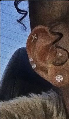 a person with some piercings on their ear