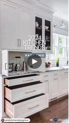 a kitchen with white cabinets and black counter tops in the center is an ad for kitchen trend