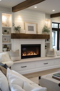 a living room filled with furniture and a fire place in the middle of the room