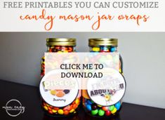 two jars filled with candy sitting on top of a table next to a sign that says, free printables you can customize any mason jar wraps