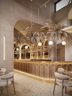 the interior of a restaurant with palm trees hanging from the ceiling and chairs around the bar