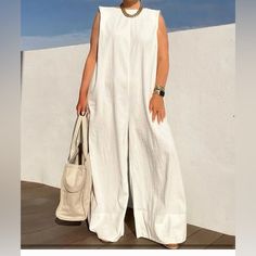 Sleeveless Solid Wide Leg Jumpsuit. Size M Never Worn. Material Is Thin. Chic Cotton Pantsuit For Spring, Chic White Pantsuit For Spring, Chic White Cotton Jumpsuits And Rompers, Summer White Pantsuit For Workwear, White Summer Pantsuit For Work, White Fitted Linen Jumpsuit, Casual White Jumpsuits For Workwear, White Wide-leg Summer Pantsuit, Romper For Women