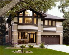 a two story house with lots of windows