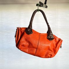 Orange Leather Purse With Gorgeous Brown Handles By Designer Paolo Masi. Comes With Original Dust Bag. Orange Shoulder Bag For Everyday Use, Orange Soft Leather Shoulder Bag With Double Handle, Orange Satchel With Handle Drop For Everyday Use, Orange Leather Hobo Bag For Shopping, Leather Pouch Bag With Braided Handles, Orange Satchel Shoulder Bag With Handle Drop, Orange Leather Handheld Shoulder Bag, Orange Bag With Handle Drop For Daily Use, Orange Handheld Leather Bag